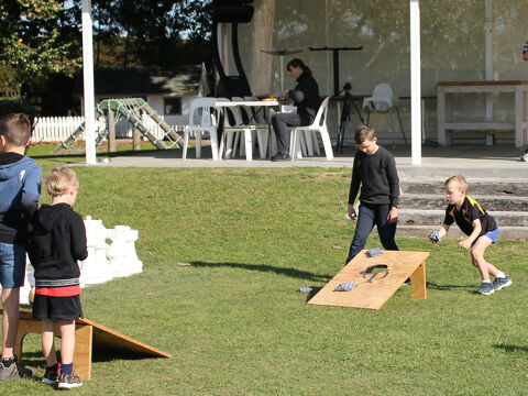 Kids playing outside cafe